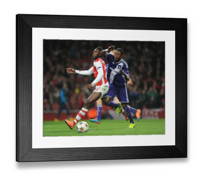 Framed Print : Arsenal's Danny Welbeck Fouled by Chancel Mbemba in UEFA Champions League Match against Anderlecht Framed Print : Arsenal's Danny Welbeck Fouled by Chancel Mbemba in UEFA Champions League Match against Anderlecht
