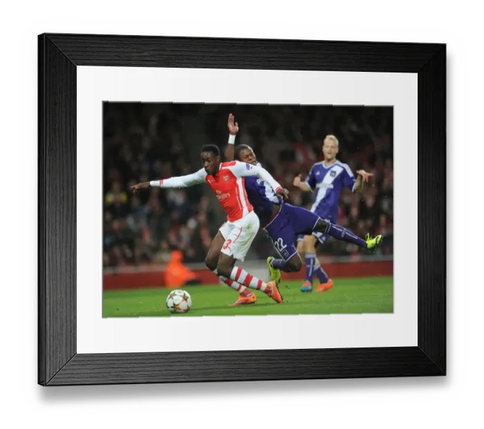 Framed Print : Arsenal's Danny Welbeck Fouled by Chancel Mbemba, Awarding a Penalty in UEFA Champions League Match against Anderlecht Framed Print : Arsenal's Danny Welbeck Fouled by Chancel Mbemba, Awarding a Penalty in UEFA Champions League Match against Anderlecht