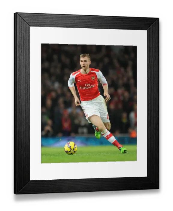 Framed Print : Per Mertesacker Focuses in Arsenal vs Manchester United Clash (2014-15)