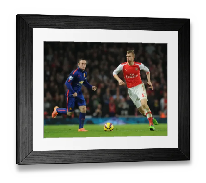 Framed Print : Clash of Titans: Per Mertesacker vs Wayne Rooney - Arsenal v Manchester United, Premier League 2014 Framed Print : Clash of Titans: Per Mertesacker vs Wayne Rooney - Arsenal v Manchester United, Premier League 2014