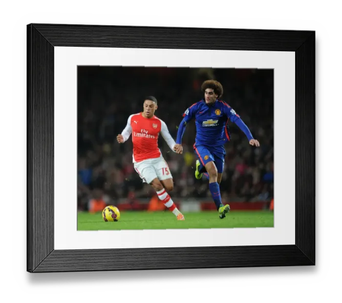 Framed Print : Arsenal's Oxlade-Chamberlain vs Manchester United's Fellaini: A Premier League Showdown at Emirates Stadium Framed Print : Arsenal's Oxlade-Chamberlain vs Manchester United's Fellaini: A Premier League Showdown at Emirates Stadium