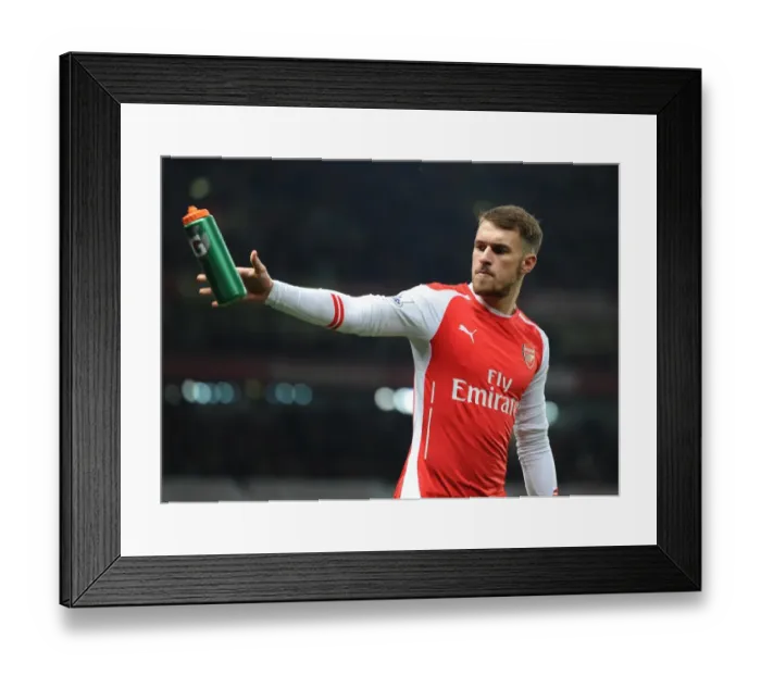 Framed Print : Arsenal's Aaron Ramsey Fueled by Gatorade: Arsenal's 2-1 Victory over Manchester United, Barclays Premier League, 2014