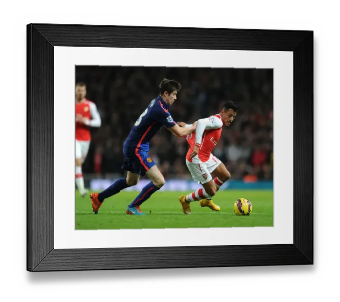 Framed Print : Clash of Stars: Sanchez vs. McNair in Arsenal vs. Manchester United Showdown