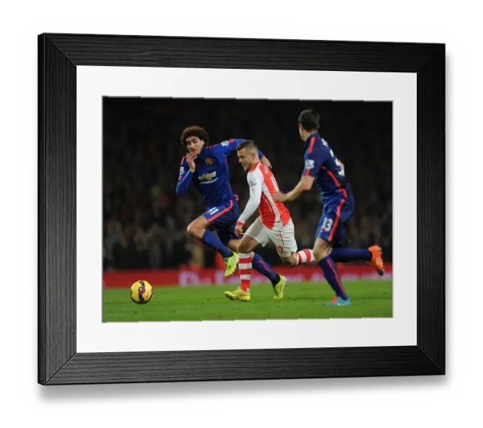 Framed Print : Jack Wilshere Battles Past Fellaini and McNair in Arsenal vs Manchester United Clash (2014-15) Framed Print : Jack Wilshere Battles Past Fellaini and McNair in Arsenal vs Manchester United Clash (2014-15)