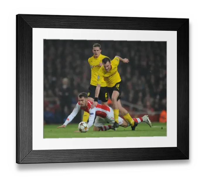 Framed Print : Aaron Ramsey (Arsenal) Kevin Grosskreutz (Dortmund). Arsenal 2: 0 Borussia Dortmund Framed Print : Aaron Ramsey (Arsenal) Kevin Grosskreutz (Dortmund). Arsenal 2: 0 Borussia Dortmund
