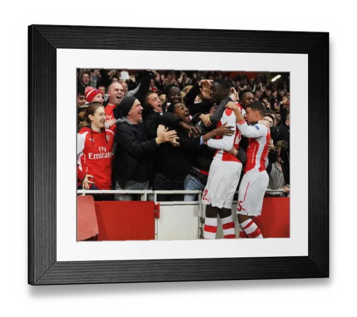 Framed Print : Yaya Sanogo's Thrilling Goal: Arsenal Stuns Borussia Dortmund in Champions League