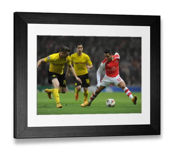 Framed Print : Clash of Stars: Sanchez vs. Piszczek - Arsenal vs. Borussia Dortmund, UEFA Champions League