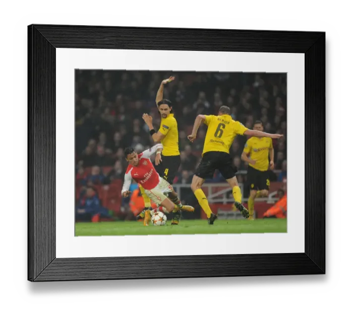 Framed Print : Arsenal's Alexis Sanchez Fouls by Dortmund's Subotic and Bender in 2014-15 Champions League Clash Framed Print : Arsenal's Alexis Sanchez Fouls by Dortmund's Subotic and Bender in 2014-15 Champions League Clash