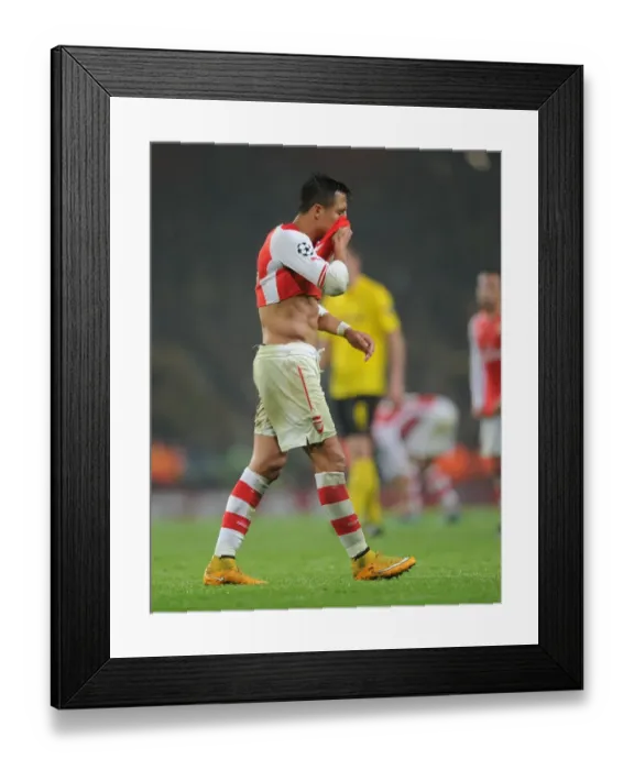 Framed Print : Champions League Showdown: Arsenal vs Borussia Dortmund - Arsenal's Alexis Sanchez Faces Off