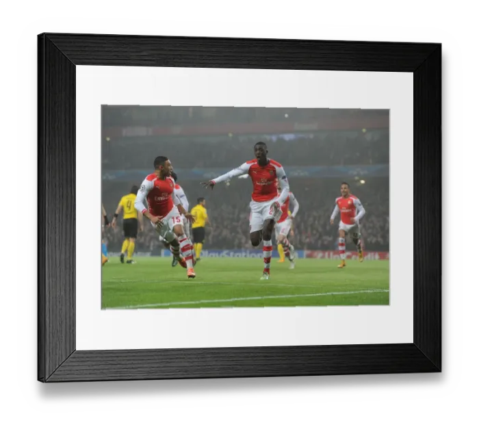 Framed Print : Arsenal Celebrate: Sanogo Scores Against Borussia Dortmund in 2014-15 Champions League