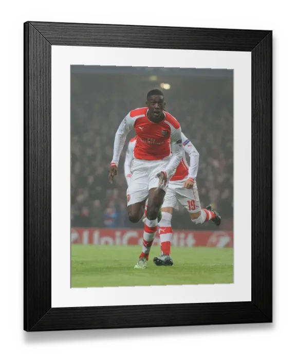 Framed Print : Yaya Sanogo's Thrilling Winner: Arsenal Triumphs Over Borussia Dortmund in Champions League