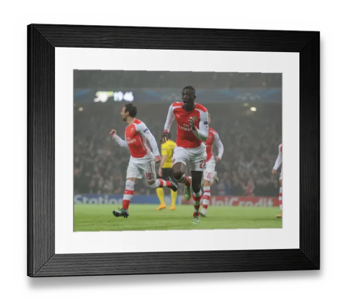 Framed Print : Arsenal's Yaya Sanogo Scores in Champions League Clash Against Borussia Dortmund Framed Print : Arsenal's Yaya Sanogo Scores in Champions League Clash Against Borussia Dortmund
