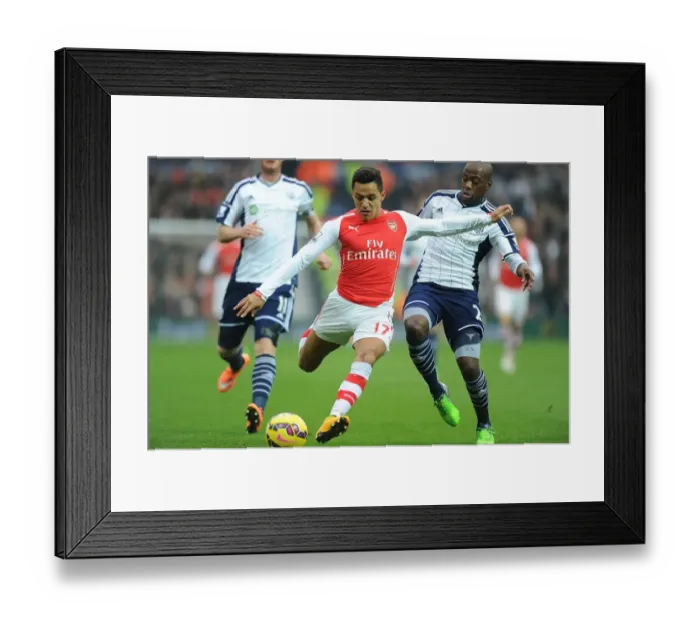 Framed Print : Alexis Sanchez's Slick Moves: Arsenal's Victory Over West Bromwich Albion - Sanchez Outmaneuvers Mulumbu Framed Print : Alexis Sanchez's Slick Moves: Arsenal's Victory Over West Bromwich Albion - Sanchez Outmaneuvers Mulumbu