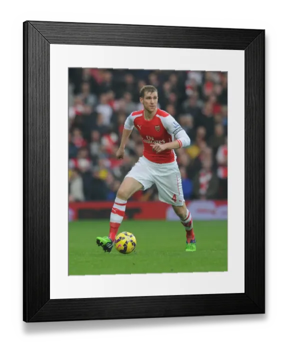 Framed Print : Per Mertesacker Focuses in Arsenal's Premier League Clash Against West Bromwich Albion (2014) Framed Print : Per Mertesacker Focuses in Arsenal's Premier League Clash Against West Bromwich Albion (2014)