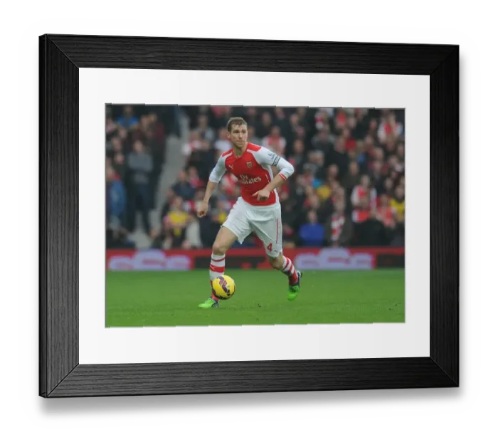 Framed Print : Per Mertesacker's Unwavering Concentration: Arsenal vs. West Bromwich Albion (November 2014)