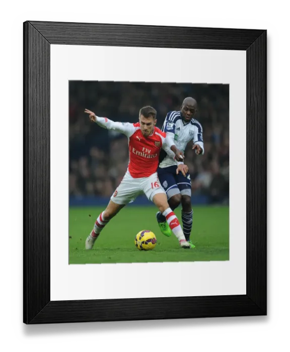 Framed Print : Ramsey vs. Mulumbu: A Football Battle at The Hawthorns Framed Print : Ramsey vs. Mulumbu: A Football Battle at The Hawthorns