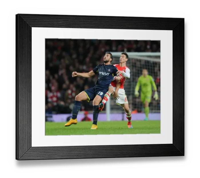 Framed Print : Clash of Titans: Koscielny vs. Pelle in Arsenal vs. Southampton Premier League Showdown