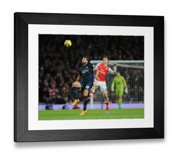 Framed Print : Arsenal vs. Southampton: Koscielny vs. Pelle - A Battle of Titans (2014-15) Framed Print : Arsenal vs. Southampton: Koscielny vs. Pelle - A Battle of Titans (2014-15)