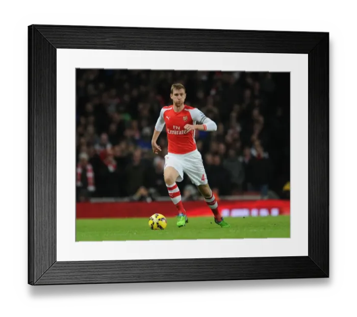 Framed Print : Per Mertesacker Focuses in Arsenal vs Southampton Premier League Clash (2014-15)