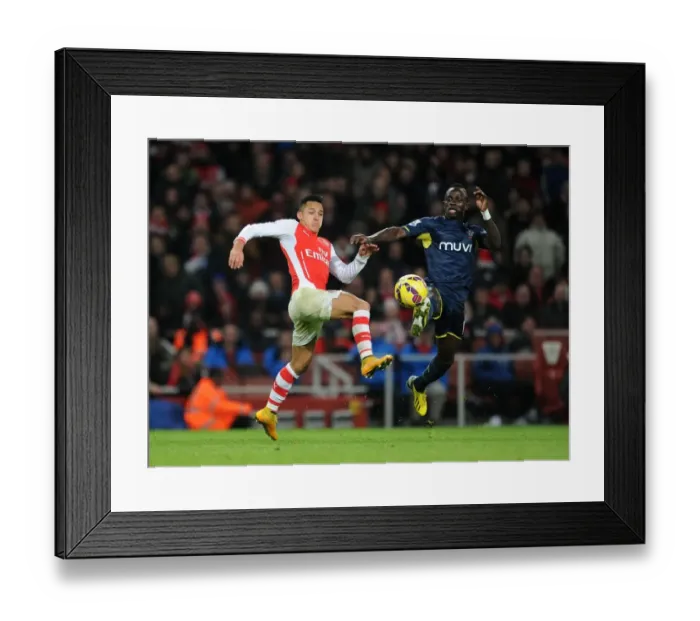 Framed Print : Clash of Stars: Sanchez vs Mane in Arsenal's Battle Against Southampton (2014-15)