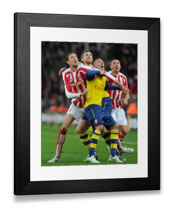 Framed Print : Per Mertesacker and Kieran Gibbs vs. Peter Crouch: Intense Battle at Stoke City vs. Arsenal (2014-15)