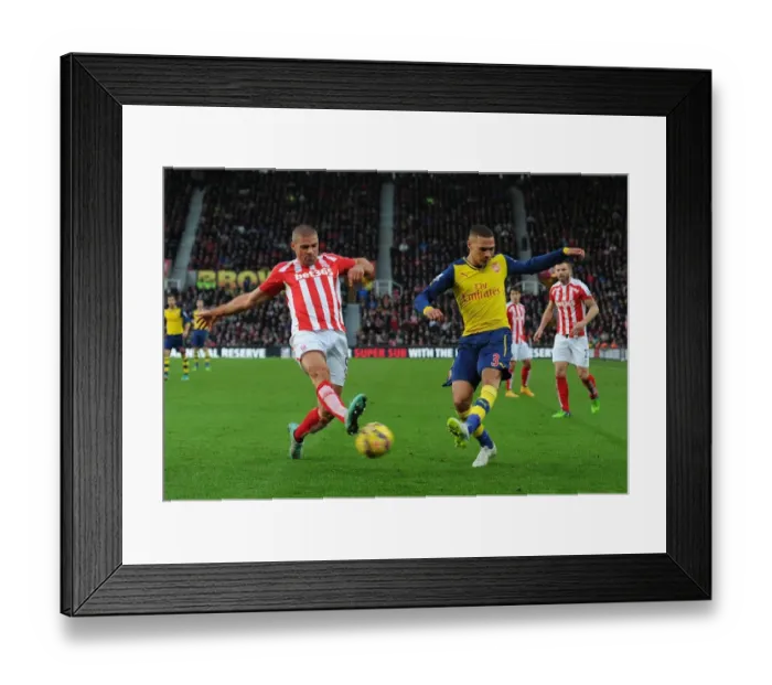 Framed Print : Arsenal's Kieran Gibbs Faces Off Against Stoke City's Jonathan Walters in Premier League Clash
