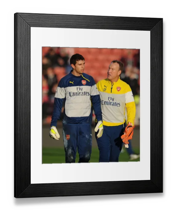 Framed Print : Emiliano Martinez and Gerry Peyton: Arsenal's Goalkeeping Duo Prepare for Stoke City Clash (December 2014)