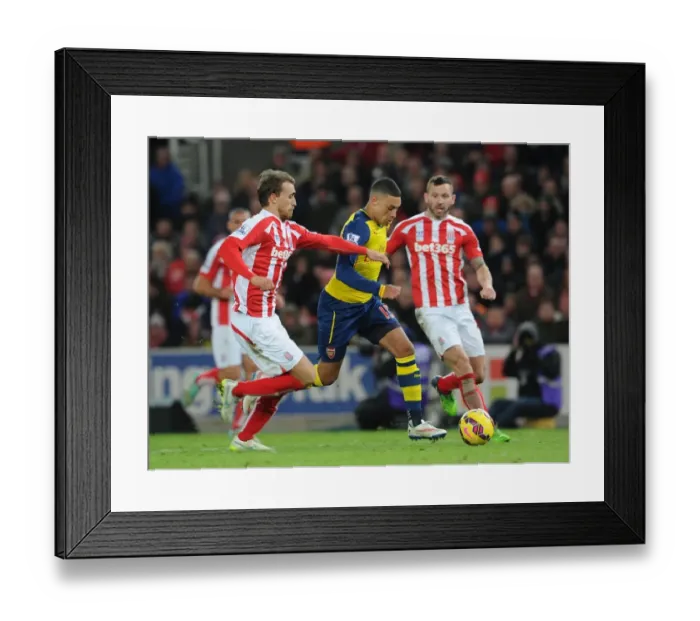 Framed Print : Alex Oxlade-Chamberlain vs Marc Muniesa: Intense Battle at Britannia Stadium Framed Print : Alex Oxlade-Chamberlain vs Marc Muniesa: Intense Battle at Britannia Stadium