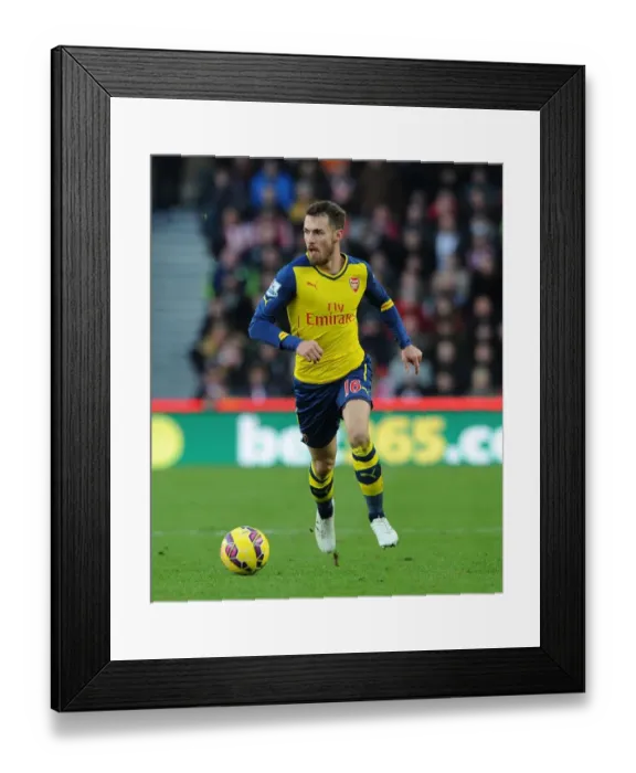 Framed Print : Aaron Ramsey in Action: Stoke City vs Arsenal, Premier League 2014-15