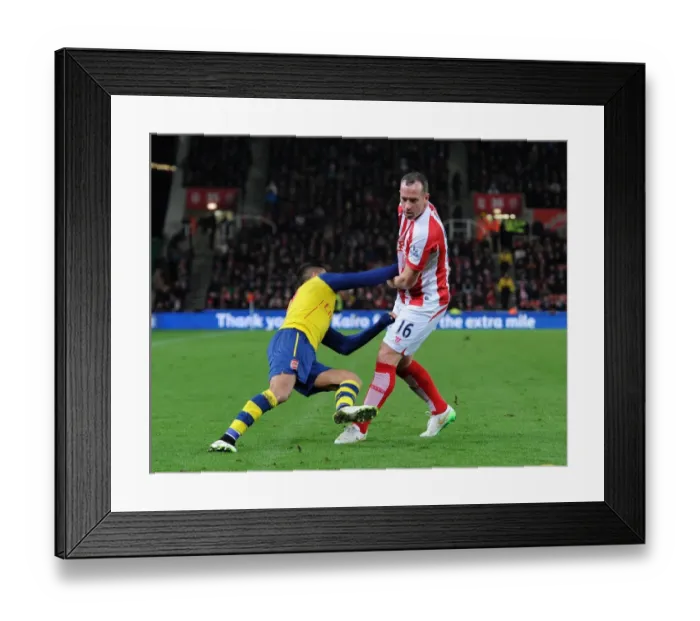 Framed Print : Alexis Sanchez Foul by Charlie Adam during Arsenal vs Stoke City (2014-15)