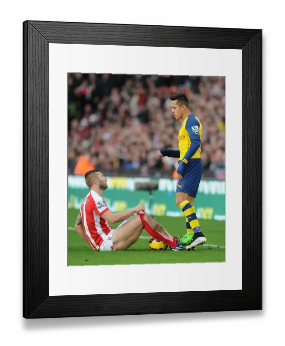 Framed Print : Alexis Sanchez and Phil Bardsley Clash in Arsenal's Victory over Stoke City Framed Print : Alexis Sanchez and Phil Bardsley Clash in Arsenal's Victory over Stoke City