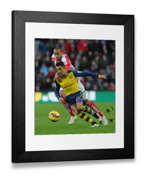 Framed Print : Sanchez vs Nzonzi: A Star-Studded Clash in Stoke City vs Arsenal (2014-15)