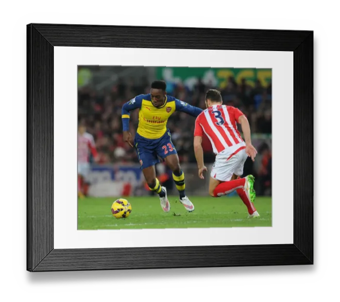 Framed Print : Danny Welbeck vs Erik Pieters: Intense Battle at Stoke City vs Arsenal (Premier League 2014-15)