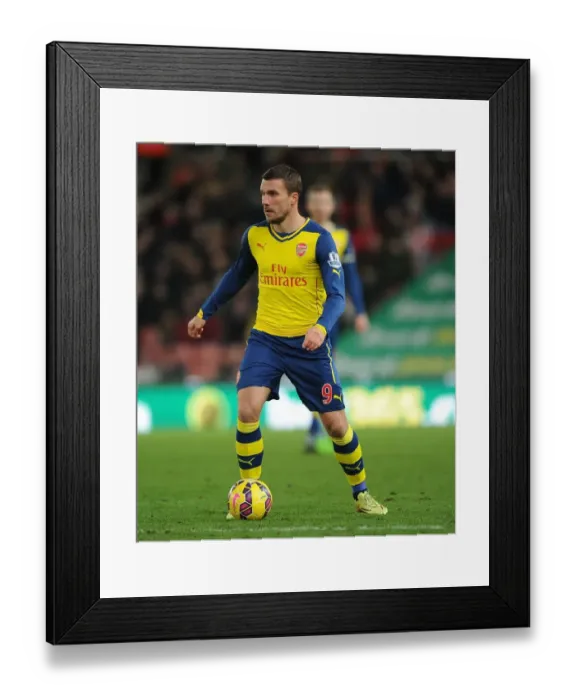 Framed Print : Lukas Podolski: Arsenal's Star at Stoke City (2014-15)
