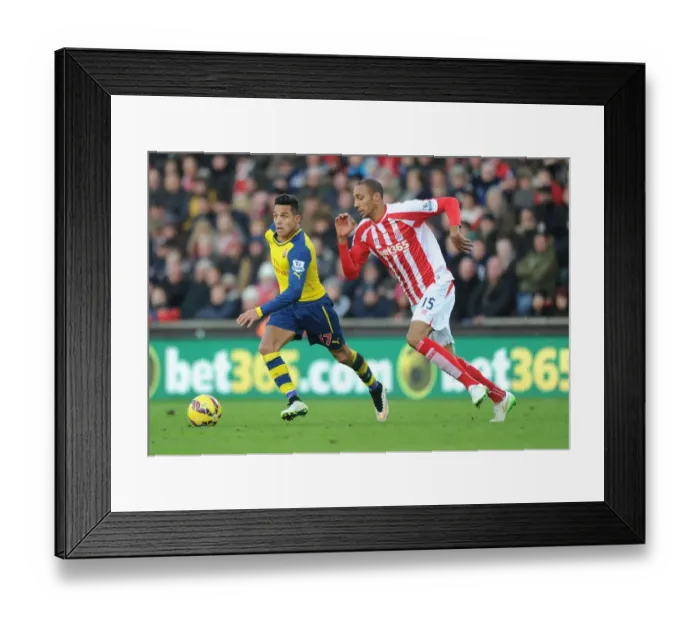 Framed Print : Alexis Sanchez vs. Steven Nzonzi: Intense Battle at the Britannia Stadium (Stoke City v Arsenal, Premier League, 2014)