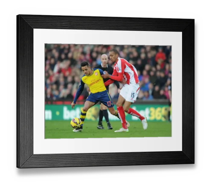 Framed Print : Arsenal's Alexis Sanchez Outmaneuvers Stoke's Steven Nzonzi during Premier League Clash