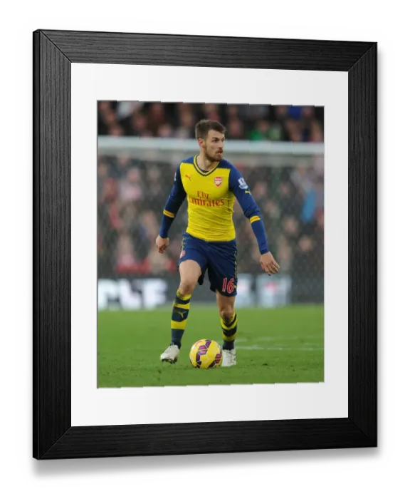 Framed Print : Aaron Ramsey in Action: Arsenal vs Stoke City, Premier League 2014-15 Framed Print : Aaron Ramsey in Action: Arsenal vs Stoke City, Premier League 2014-15