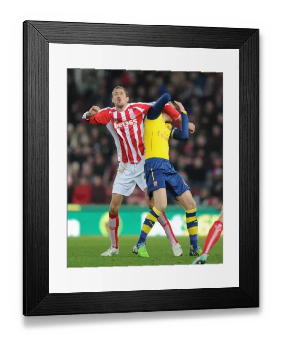 Framed Print : Clash of Titans: Per Mertesacker vs. Peter Crouch - Stoke City vs. Arsenal, Premier League, 2014 Framed Print : Clash of Titans: Per Mertesacker vs. Peter Crouch - Stoke City vs. Arsenal, Premier League, 2014