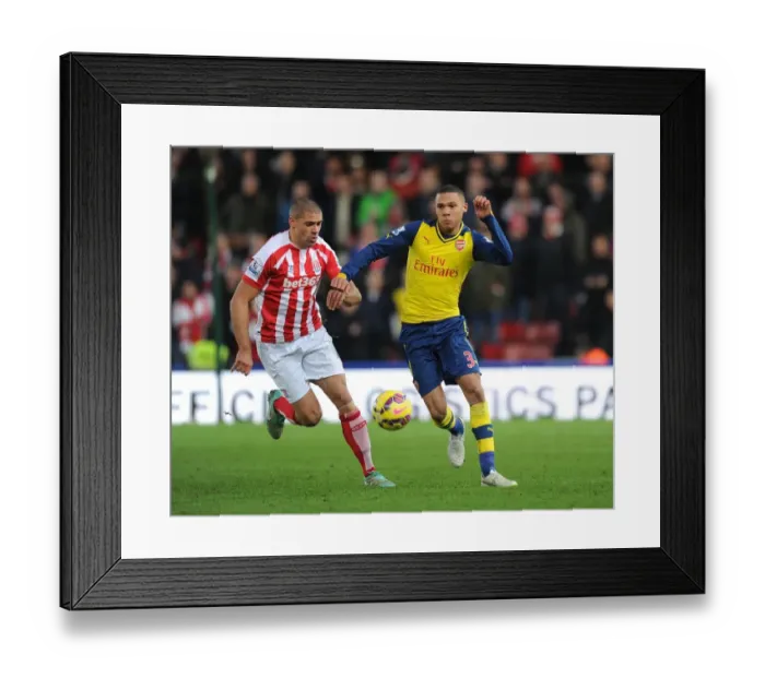 Framed Print : Arsenal's Kieran Gibbs Outmaneuvers Stoke's Jonathan Walters Framed Print : Arsenal's Kieran Gibbs Outmaneuvers Stoke's Jonathan Walters