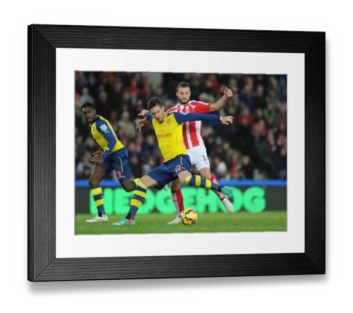 Framed Print : Giroud vs Pieters: Intense Battle at the Britannia Stadium - Stoke City vs Arsenal, Premier League 2014-15