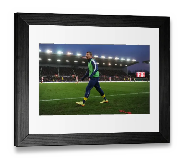 Framed Print : Lukas Podolski in Action: Stoke City vs Arsenal, Premier League 2014-15 Framed Print : Lukas Podolski in Action: Stoke City vs Arsenal, Premier League 2014-15