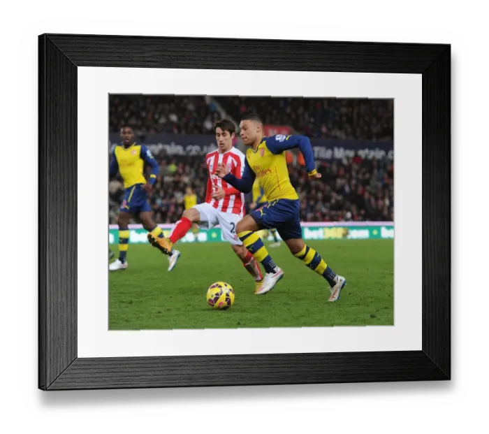 Framed Print : Alex Oxlade-Chamberlain Outmaneuvers Bojan: A Moment from Stoke City vs. Arsenal (2014-15)