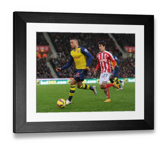 Framed Print : Alex Oxlade-Chamberlain's Sneaky Move: Outsmarting Bojan in the Stoke City vs. Arsenal Clash (2014-15)