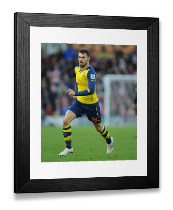 Framed Print : STOKE ON TRENT, ENGLAND - DECEMBER 06: Aaron Ramsey of Arsenal during the Barclays Premier League match between Stoke