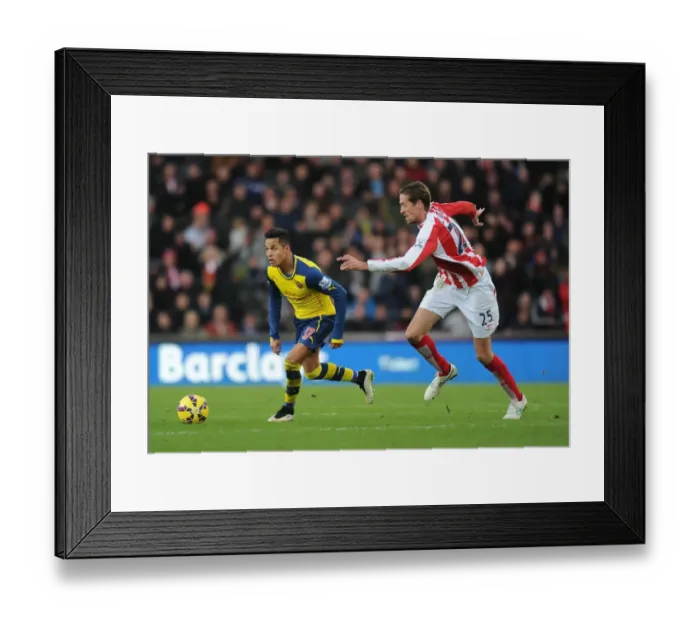 Framed Print : Alexis Sanchez Outmaneuvers Peter Crouch: A Moment from the Stoke City vs. Arsenal Premier League Clash (2014-15) Framed Print : Alexis Sanchez Outmaneuvers Peter Crouch: A Moment from the Stoke City vs. Arsenal Premier League Clash (2014-15)