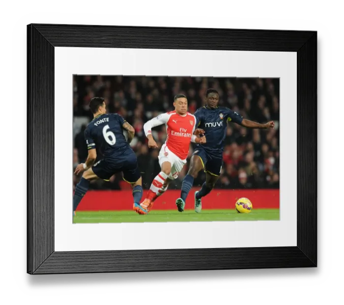 Framed Print : Arsenal's Alex Oxlade-Chamberlain Dashes Past Southampton's Jose Fonte and Victor Wanyama Framed Print : Arsenal's Alex Oxlade-Chamberlain Dashes Past Southampton's Jose Fonte and Victor Wanyama