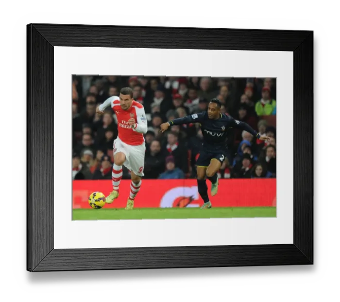 Framed Print : Podolski Outmaneuvers Clyne: Arsenal vs Southampton, Premier League 2014-15