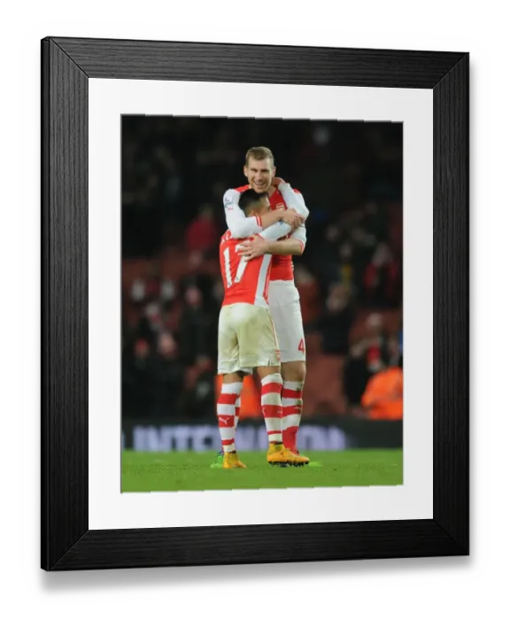 Framed Print : Arsenal's Unstoppable Duo: Sanchez and Mertesacker Celebrate Victory (2014-15)