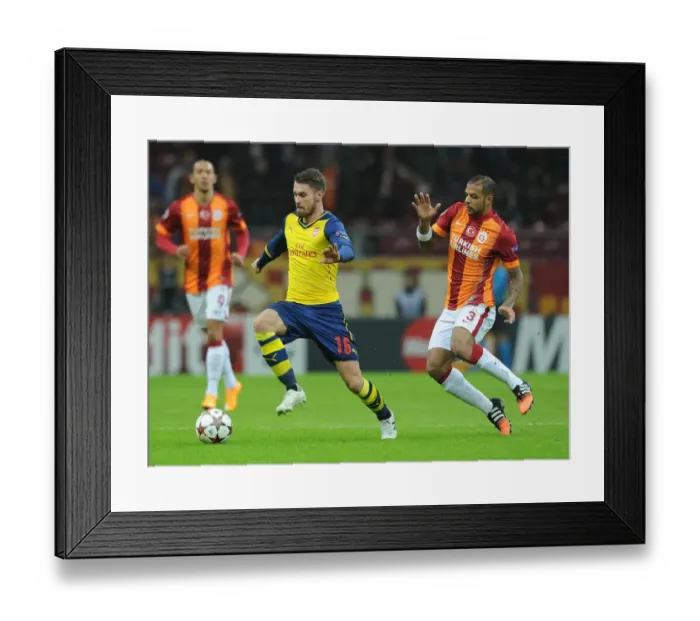 Framed Print : Arsenal's Aaron Ramsey Outsmarts Felipe Melo in UEFA Champions League Clash