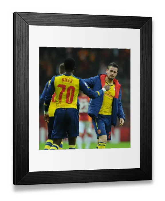 Framed Print : Celebrating Victory: Debuchy and Maitland-Niles High-Five After Arsenal's Win Against Galatasaray Framed Print : Celebrating Victory: Debuchy and Maitland-Niles High-Five After Arsenal's Win Against Galatasaray